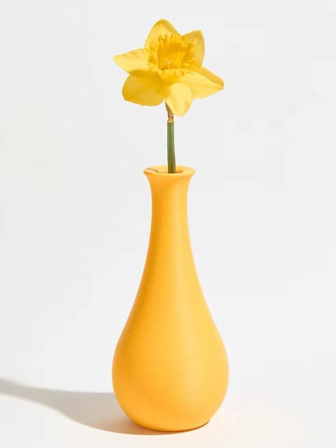 tear drop shaped yellow 3d printed vase with yellow flower