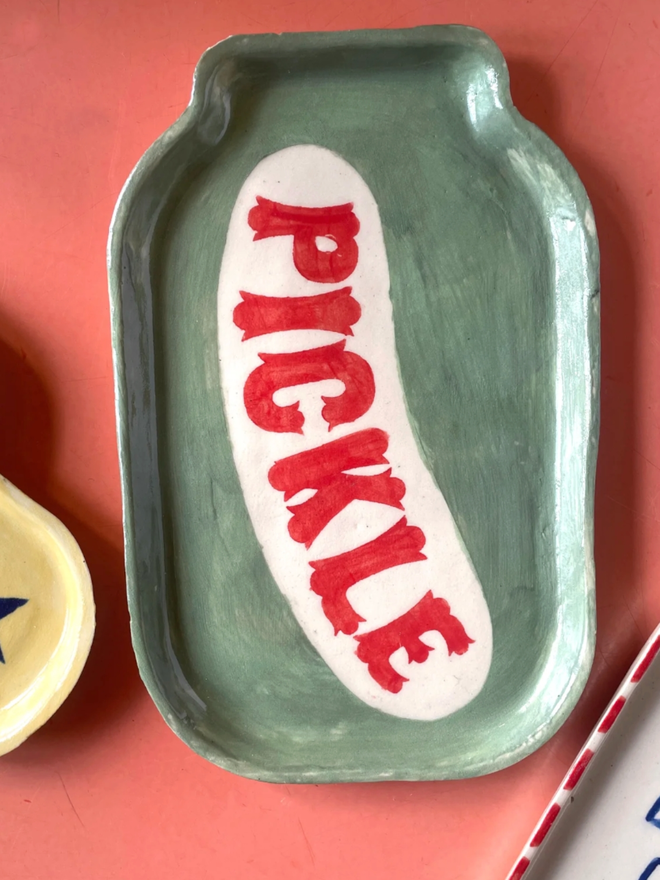 Pickle Dish. A plate shaped like a jar of pickles.