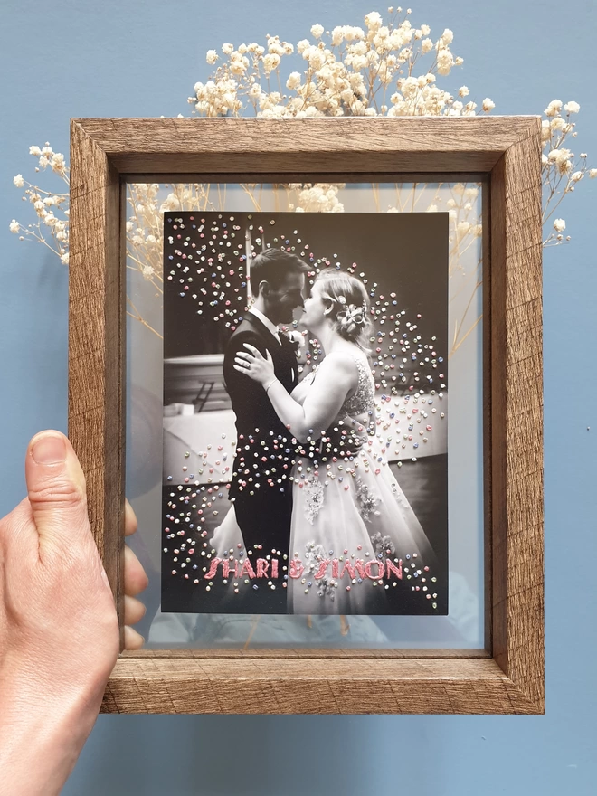  Wedding photo with hand embroidered confetti and name held in double glass frame