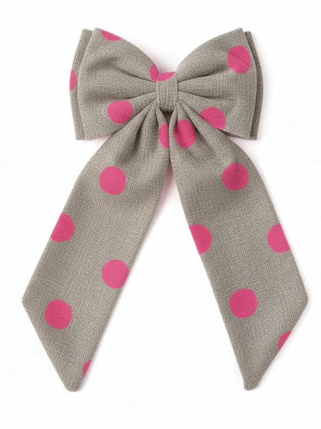 Over Sized Linen Polka Dot Bow Hanging Christmas Decoration, neon pink polka dot bow placed in front of a white background. 