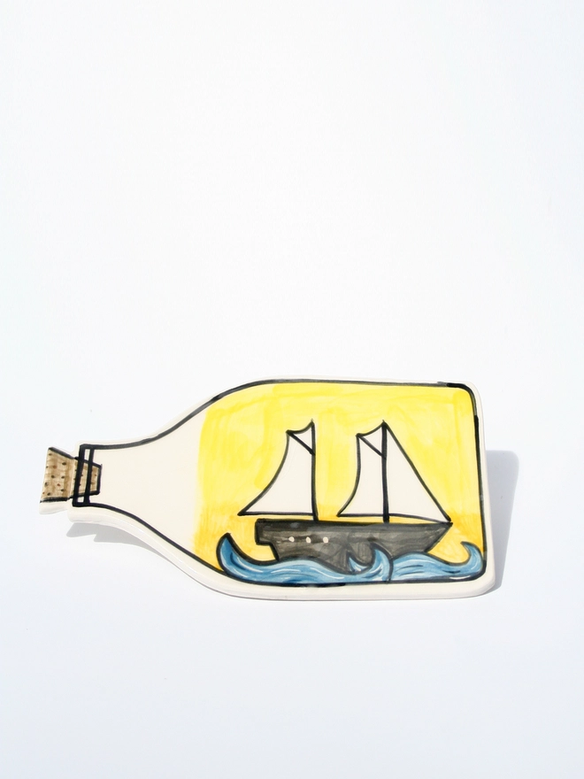 handmade ceramic ship in bottle and pint of prawns wall hanging 
