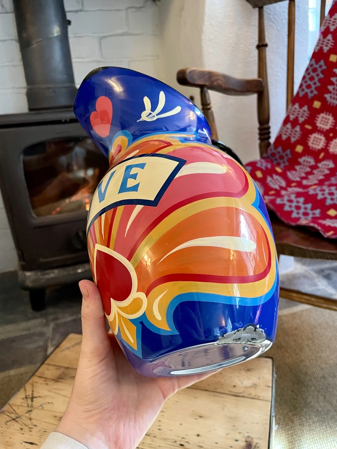 Small patch of wear on outside of blue enamel jug.