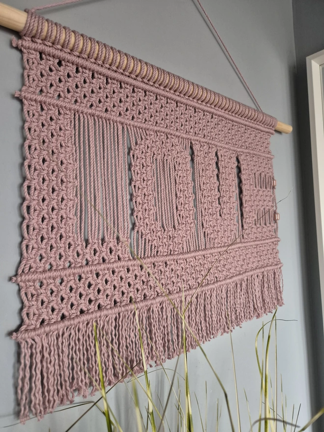 Love macrame wall hanging art for your walls adding texture and warmth perfect gift for Valentine's day, pink with a wood dowel