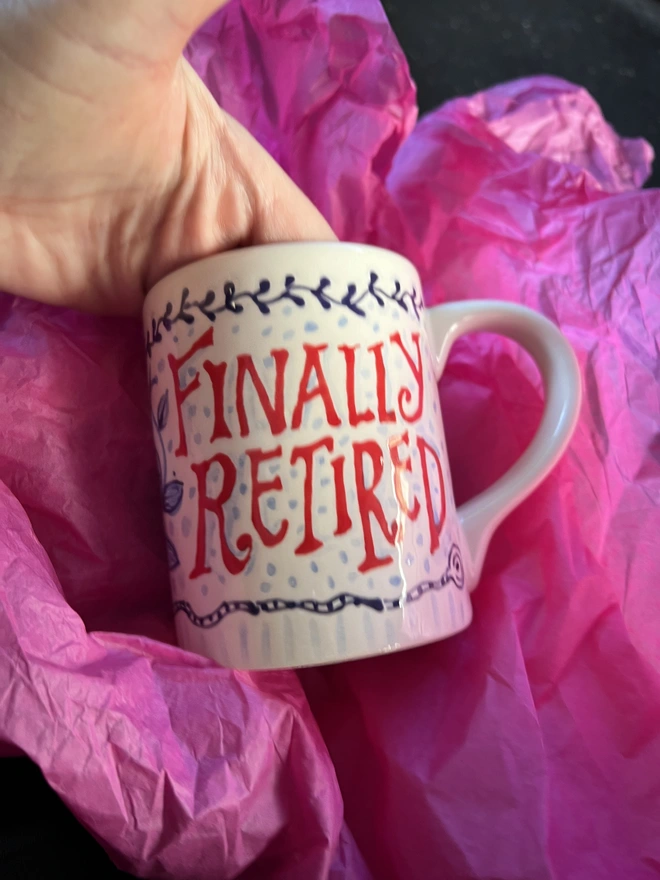 "Finally Retired" hand-painted in big red letters bespoke for a special commission. 