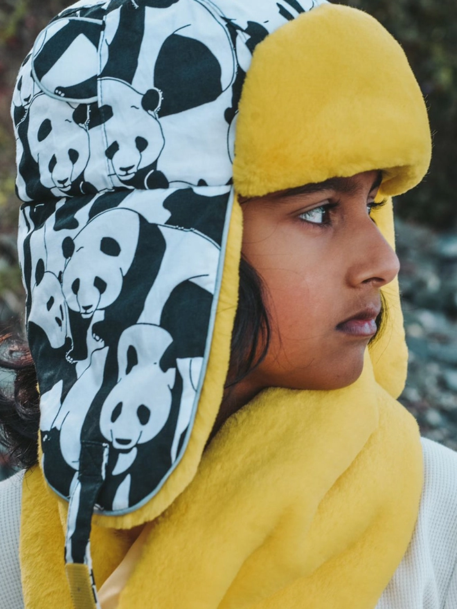 Girl wearing winter faux fur scarf yellow