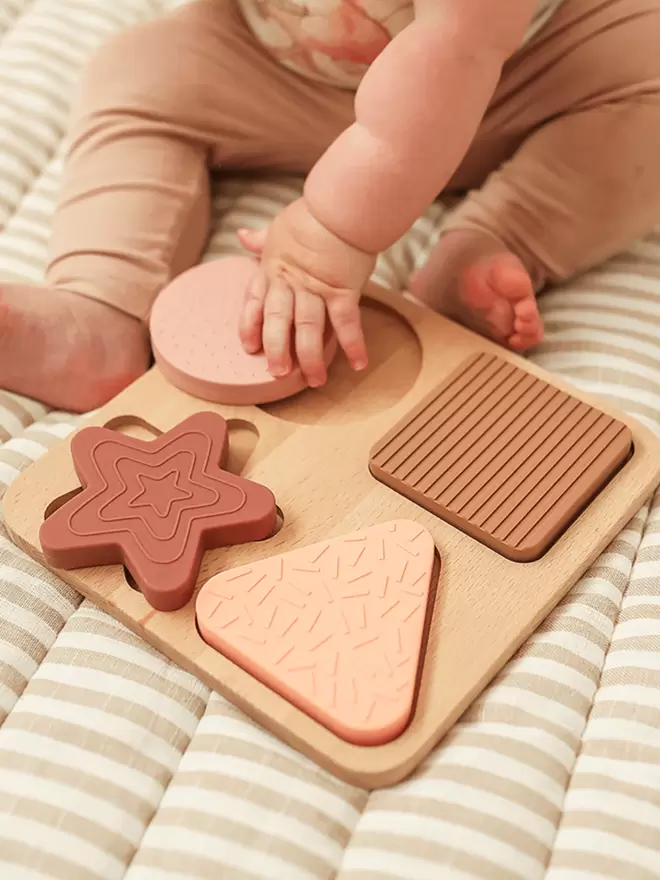 Teether Shape Puzzle in blush, camel, berry and peach