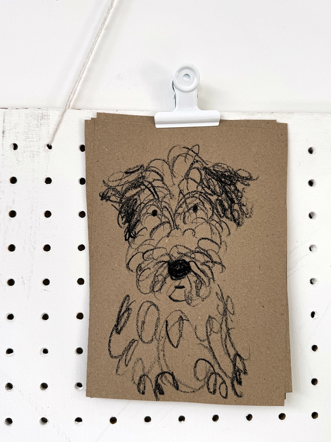 drawing of dog on brown paper 