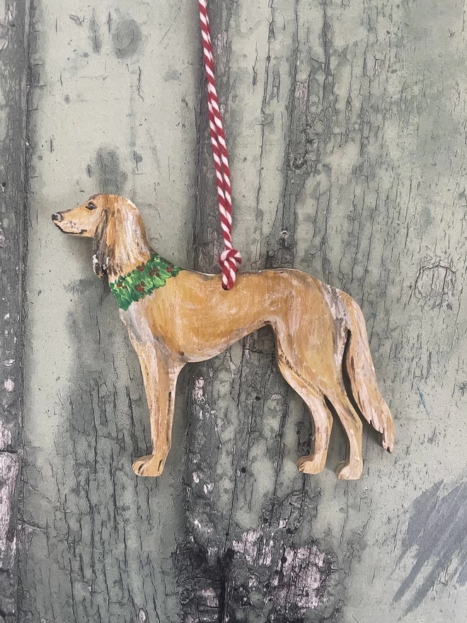 Saluki Dog Decoration with a painted Holly Wreath around its neck