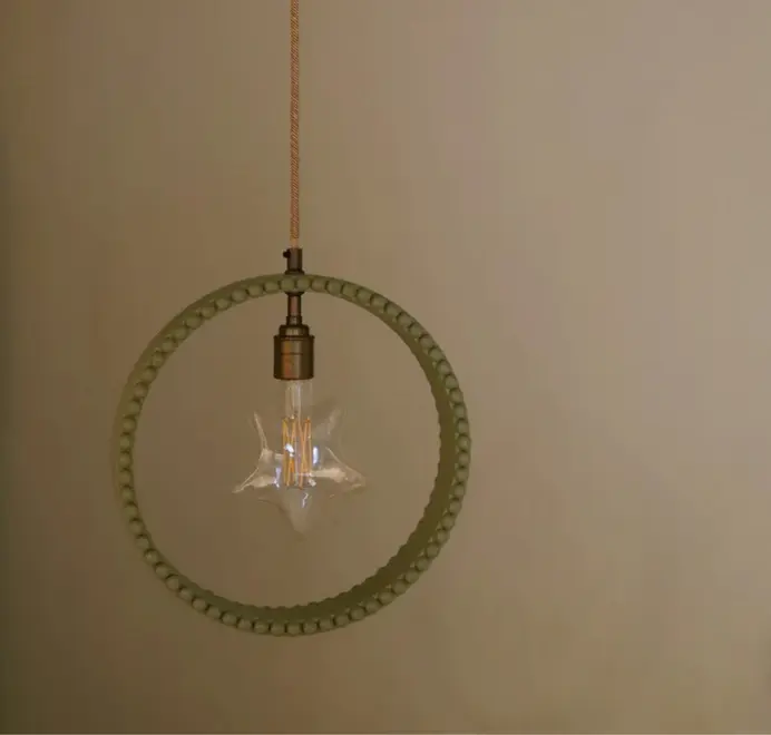 ring shaped pendant lamp in green with bobbin rim