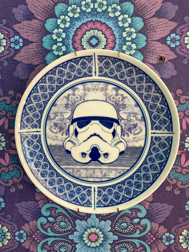 Delft style blue and white 8" plate featuring a Stormtrooper head in the centre