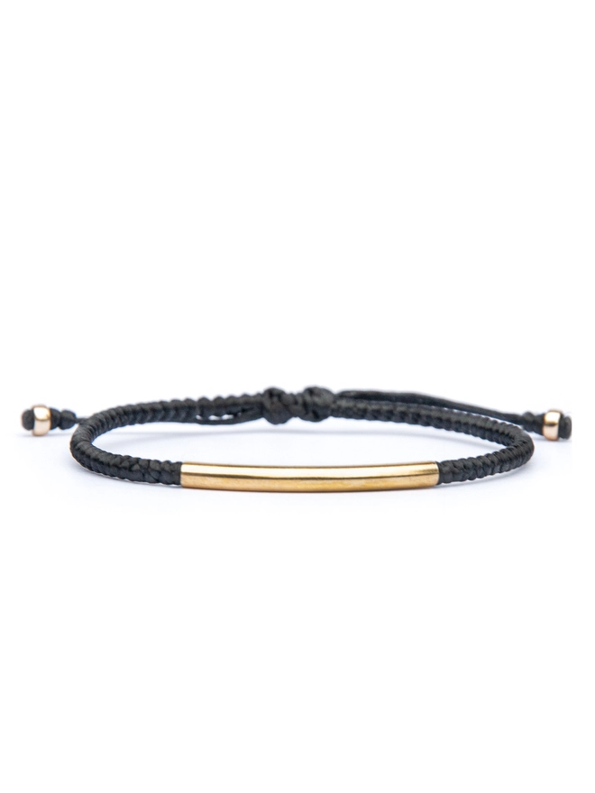 black rope and gold bracelet