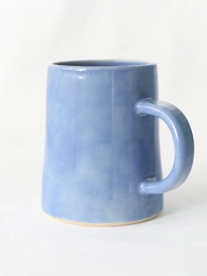 Ceramic Pint Mug, a colourful ceramic mug sitting on a white surface against a plain backdrop. 