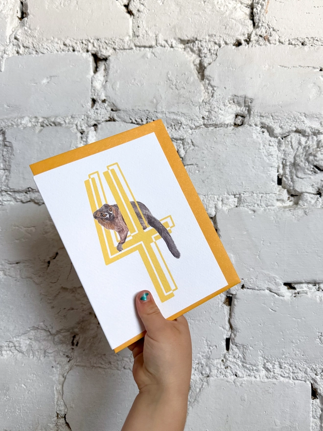 a white card with a big yellow 4 and a lemur illustration with a bright yellow envelope