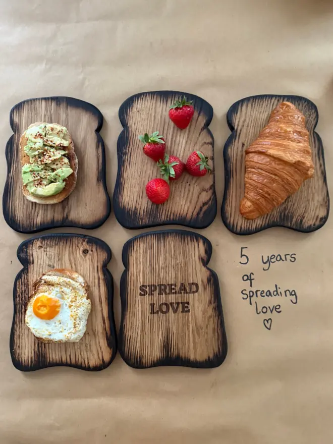 Toast shaped wood serving board styled with different breakfast ideas,and one board with spread love engraved.