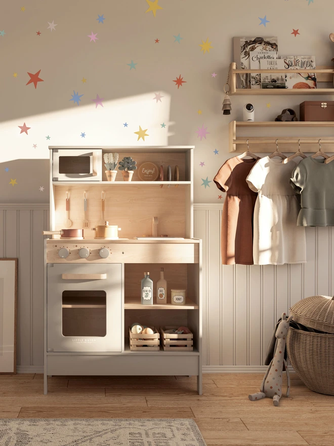 Ducks In A Row Summer Pastel Fabric Star Wall Stickers in girls bedroom with play kitchen and shelving