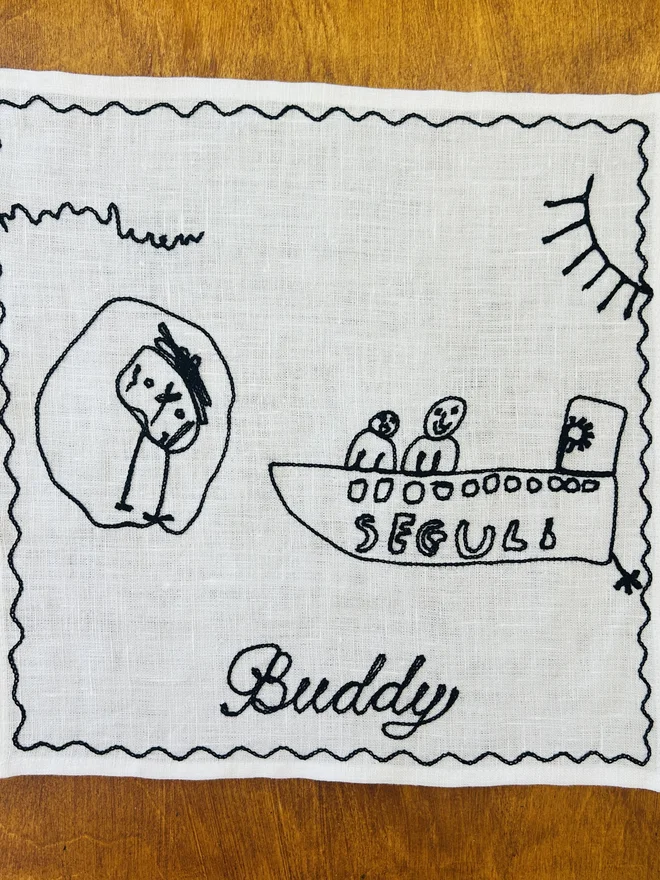 child's drawing embroidered onto linen white handkerchief black thread