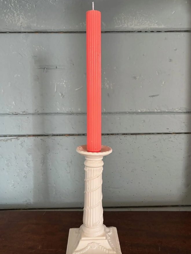 Wrapped Scalloped Dinner Candles. A candle in Coral.
