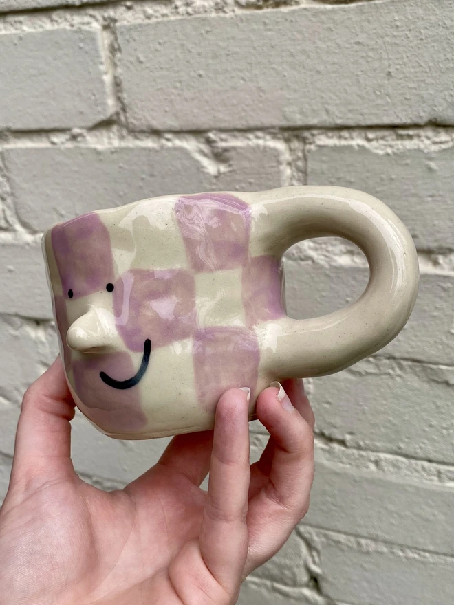 purple checkerboard mug