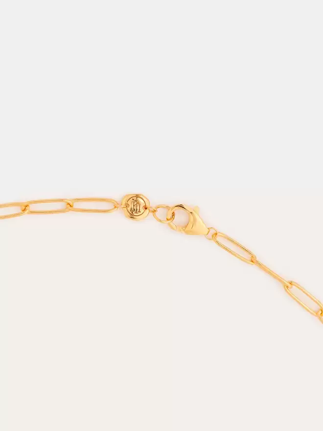 lobster clasp detailing of a paperlink gold chain necklace