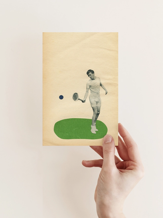 A greeting card depicting a male tennis player hitting a ball. 