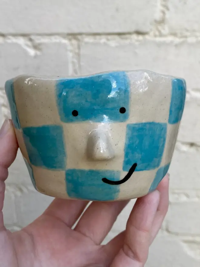 blue white check handmade ceramic smiley face pot