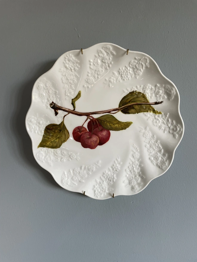 oil painting of apples on antique plate