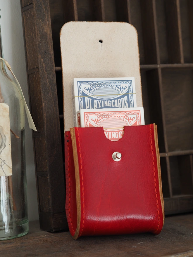 Handmade Leather Double Deck Playing Card Holder. Hand dyed red leather pouch carrying two brand new packs of playing cards.