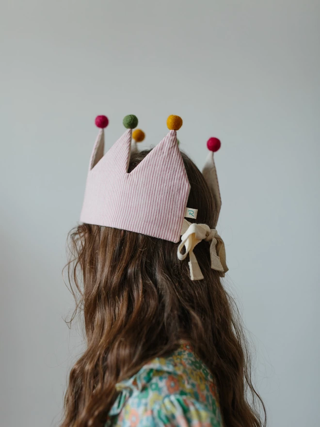 Girl with long hair showing the Back view of stripe circus crown