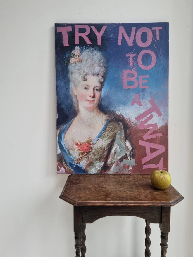 Painted and decoupage art panel featuring an antique portrait of an aristocratic lady and pink wording that reads ‘try not to be a twat’