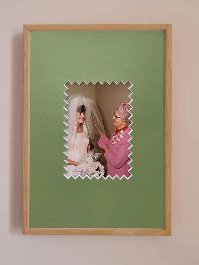 Ziggy photo mount frame ,displaying a centered portrait photo, hung on a neutral beige wall.