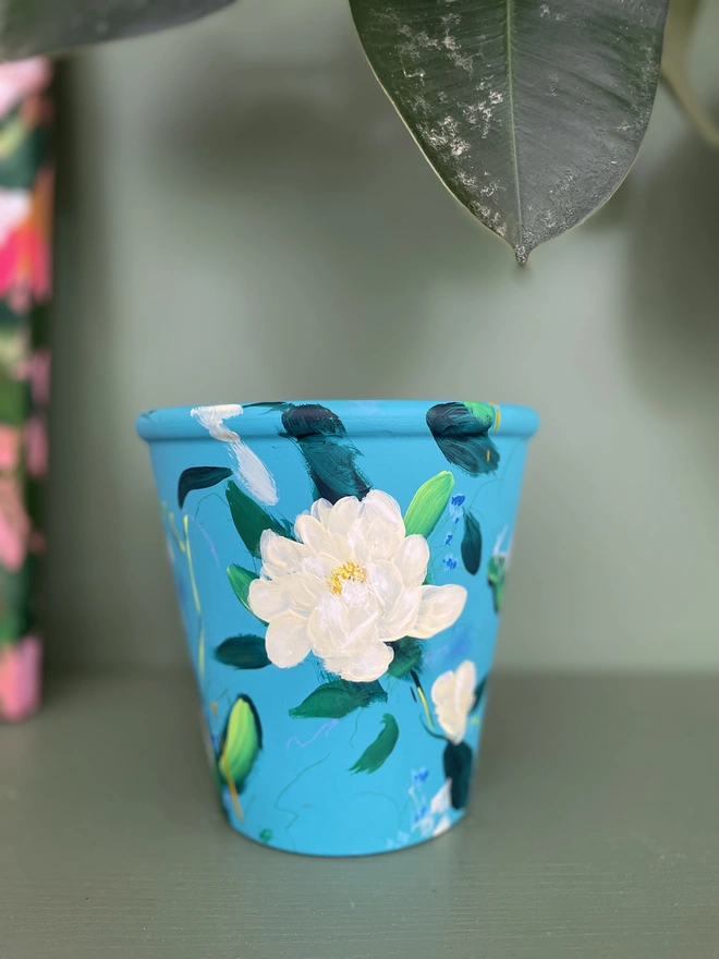 Hand painted floral plant pot, turquoise background with pale yellow peonies 