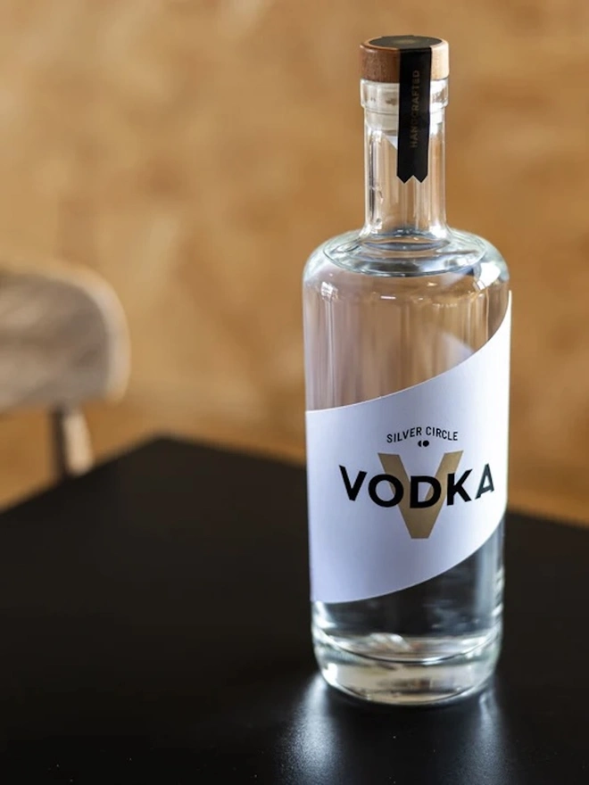 Silver Circle Vodka, bottle of spirit on a table. 