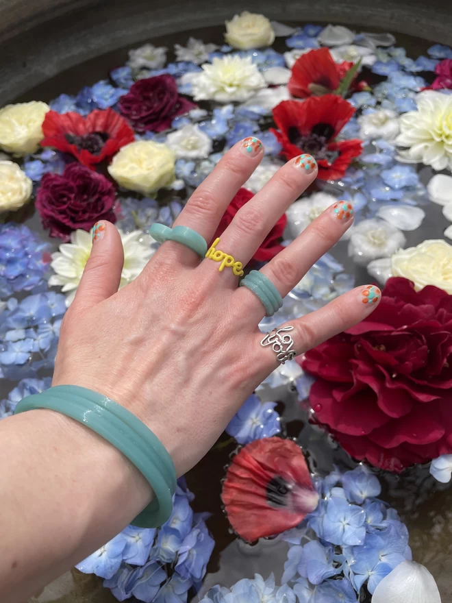Recycled fishing net bangles layered