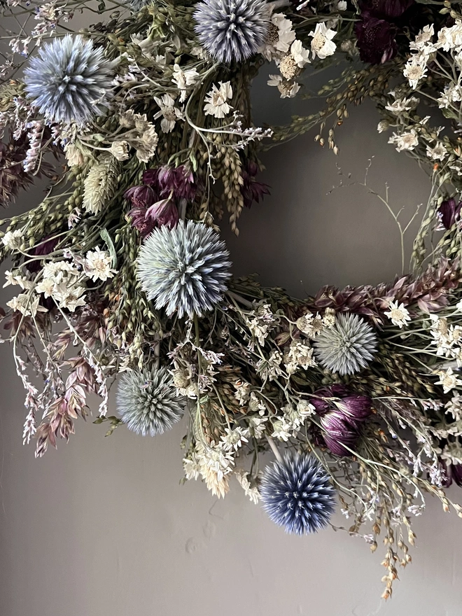 Dried Flower Winter Wreath hanging on kitchen wall 