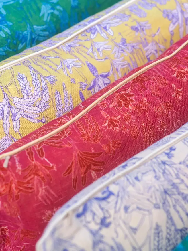 four tropicalia cushions in various colours