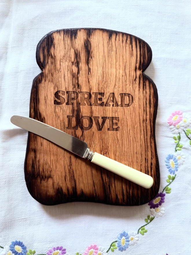 Small toast serving board with optional vintage butter knife and spread love message.