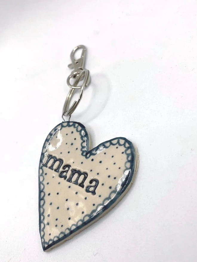 Mama Heart Ceramic Keyring, a blue keyring sitting on a plain white surface. 
