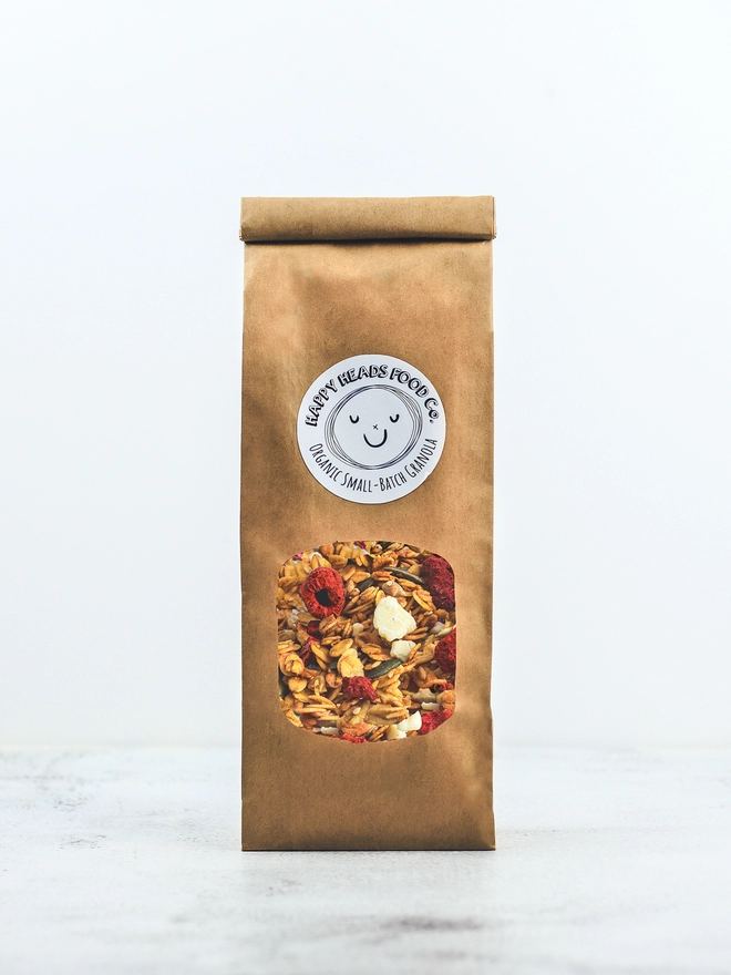 Happy Heads 'Raspberry & White Chocolate' granola in a small (350 g) refill bag 