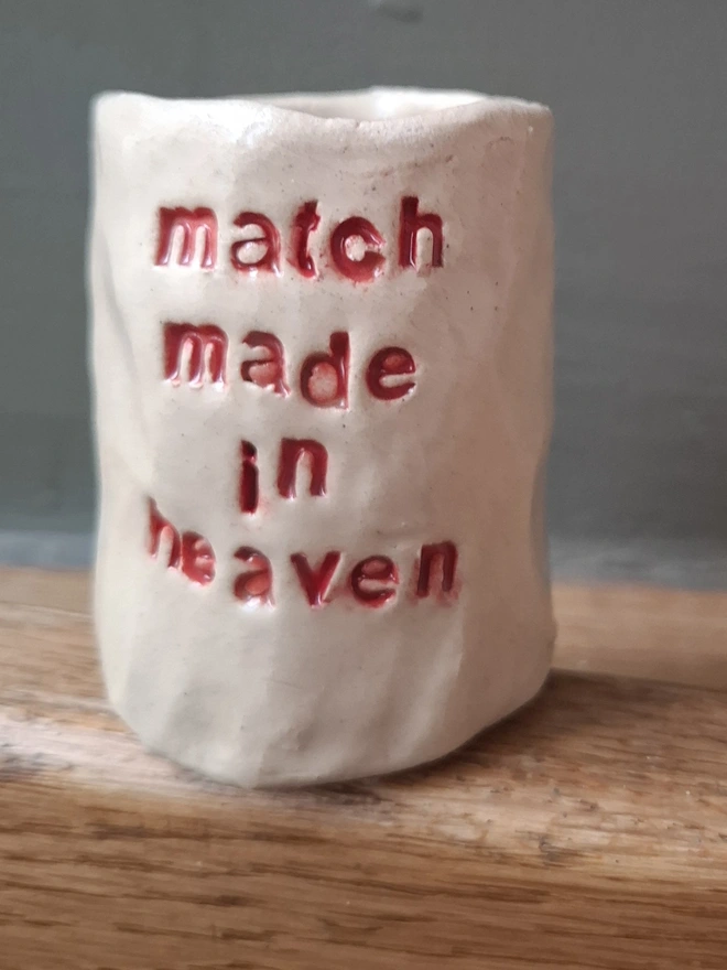 Ceramic Match Holder with the phrase 'Match made in heaven' stamped into it 