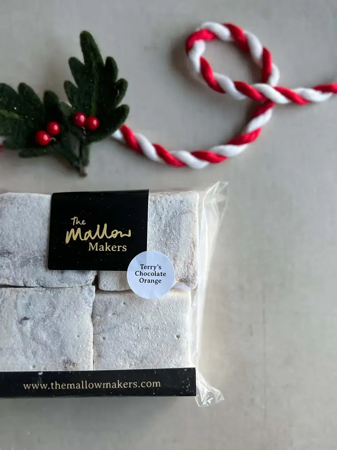 The-Mallow-makers-Looking-down-on-packet-of-four-terrys-chocolate-orange-handmade-marshmallows-with-christmas-ribbon