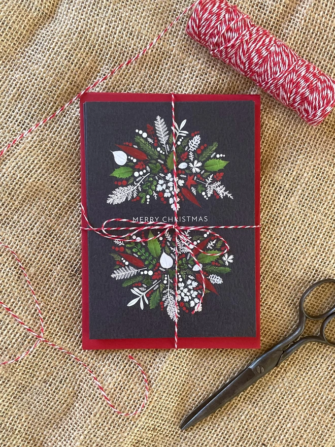 Bundle of Christmas Cards Tied with Red and White Twine - Laying on Hessian Background - Vintage Scissors and Twine Spool
