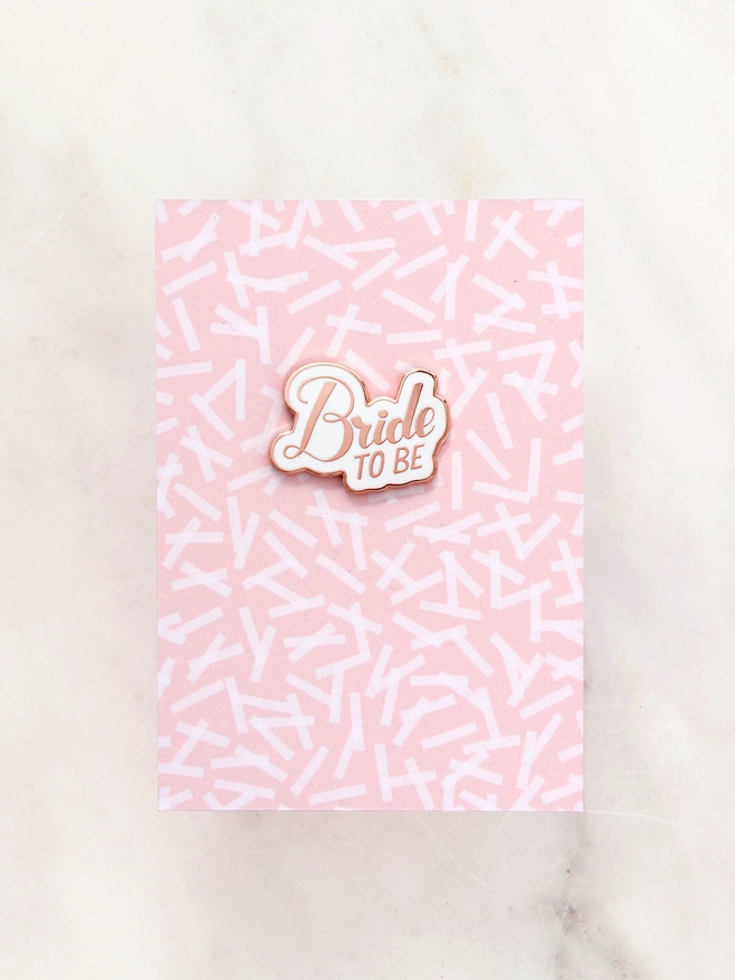 bride to be enamel pin badge on confetti print backing board