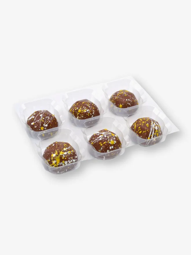 a tray of 6 luxury pina colada chocolates