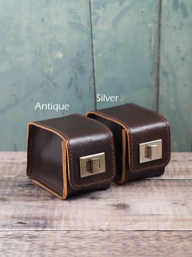 Personalised leather watch case. Hand dyed dark brown leather watch cases. One with antique brass coloured clasp, the other silver.