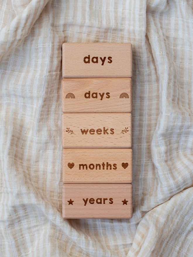 raw wooden blocks with days, weeks, months, years
