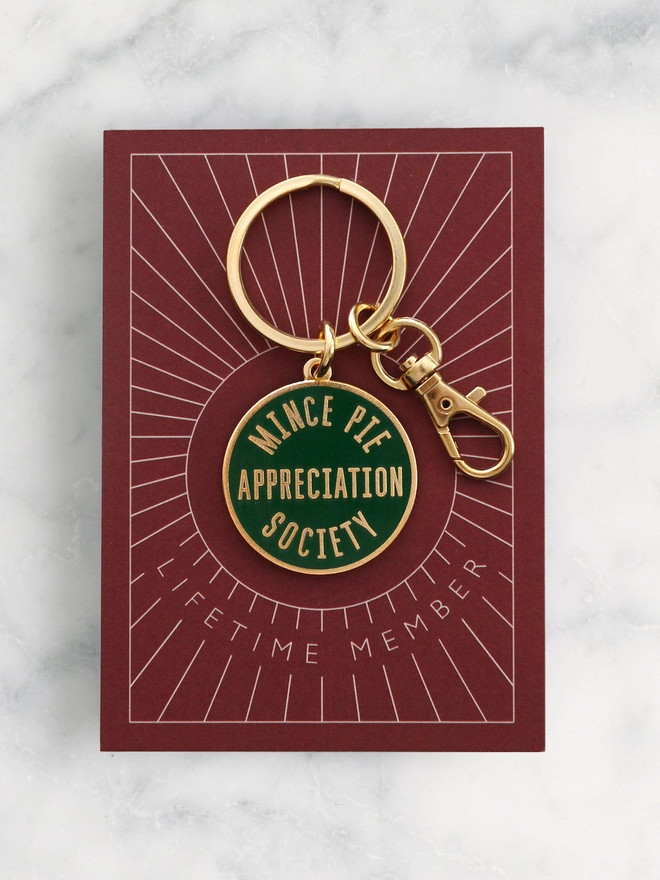 Green enamel keyring featuring 'Mince Pie Appreciation Society' design