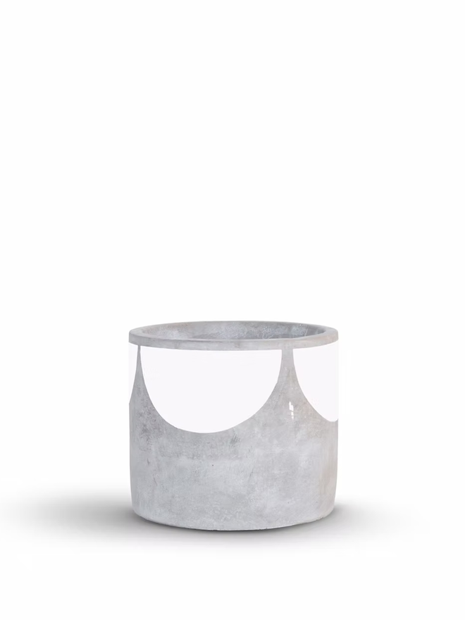 sunny concrete plant pot. a grey plant pot with a white half sun pattern painted around the top rim.