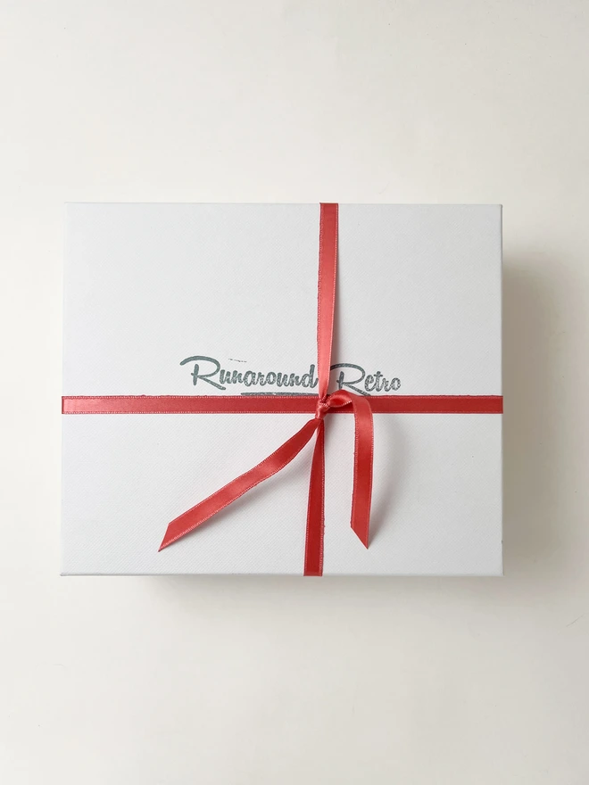 Coral pink ribbon gift box
