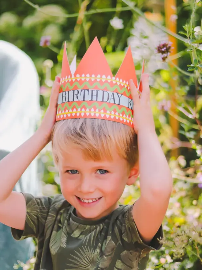 red paper crown card with birthday king text