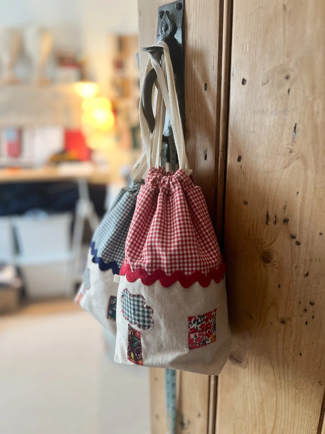 two bags on the door handle of my studio